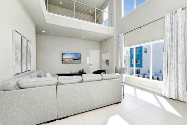 a living room with furniture and a large window