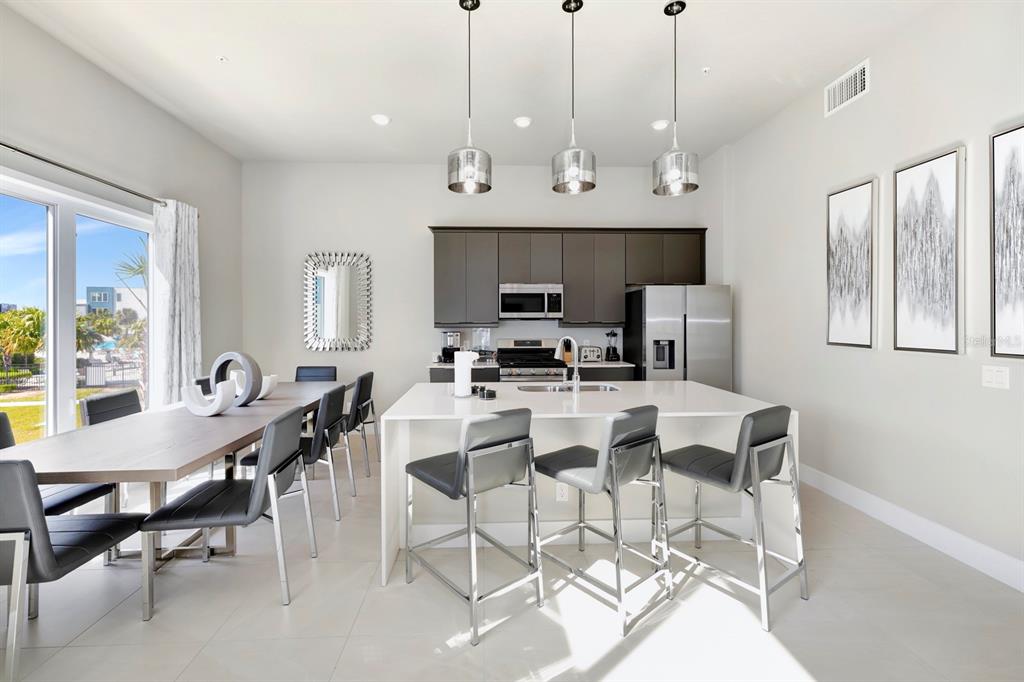 7740 Sandy Ridge Drive, Unit 220 Reunion, FL 34747 - Photo 10 of 55 a view of a dining room with furniture window and outside view