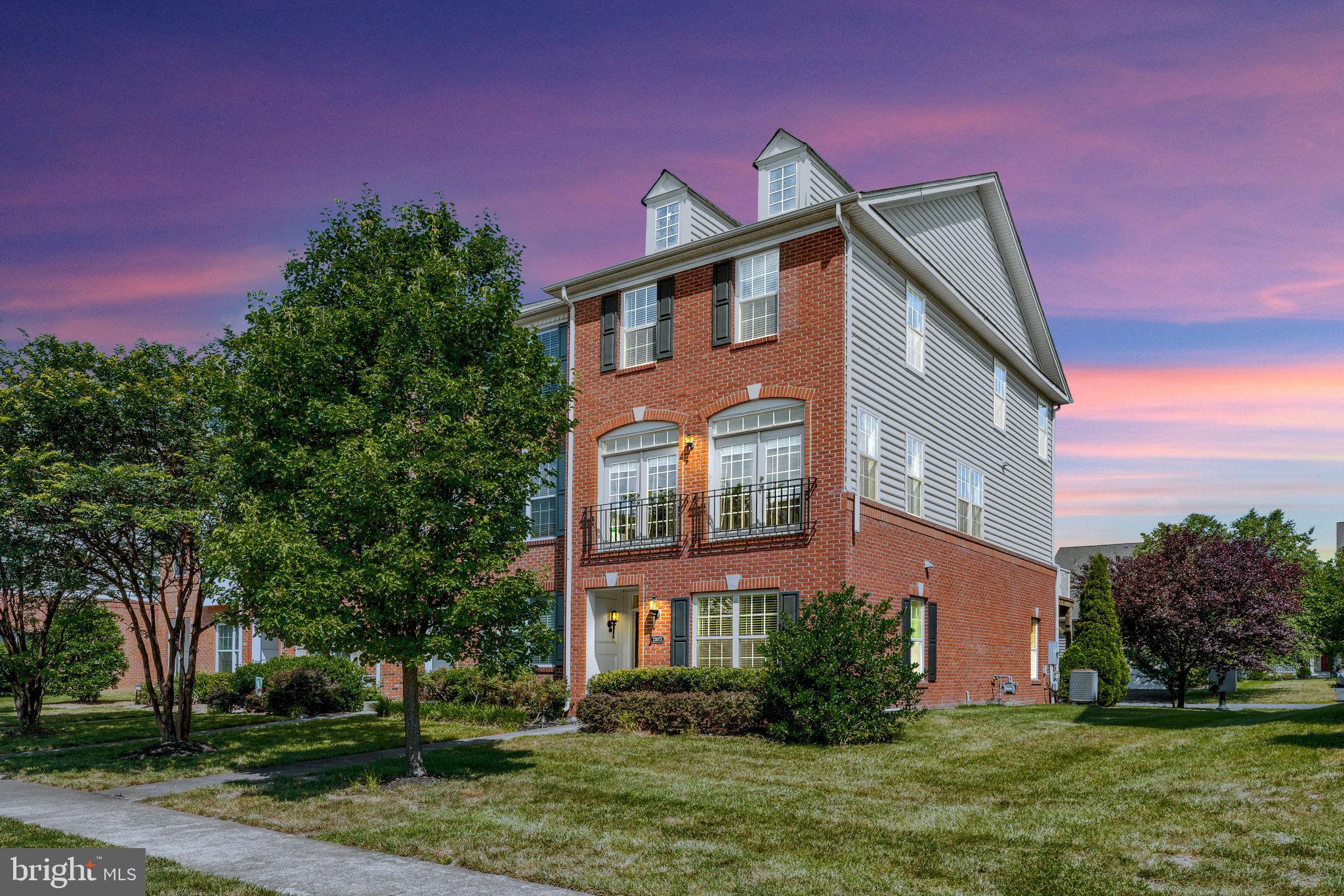 23073 Weybridge Square Broadlands, VA 20148 - Photo 1 of 24 a front view of a house with a yard