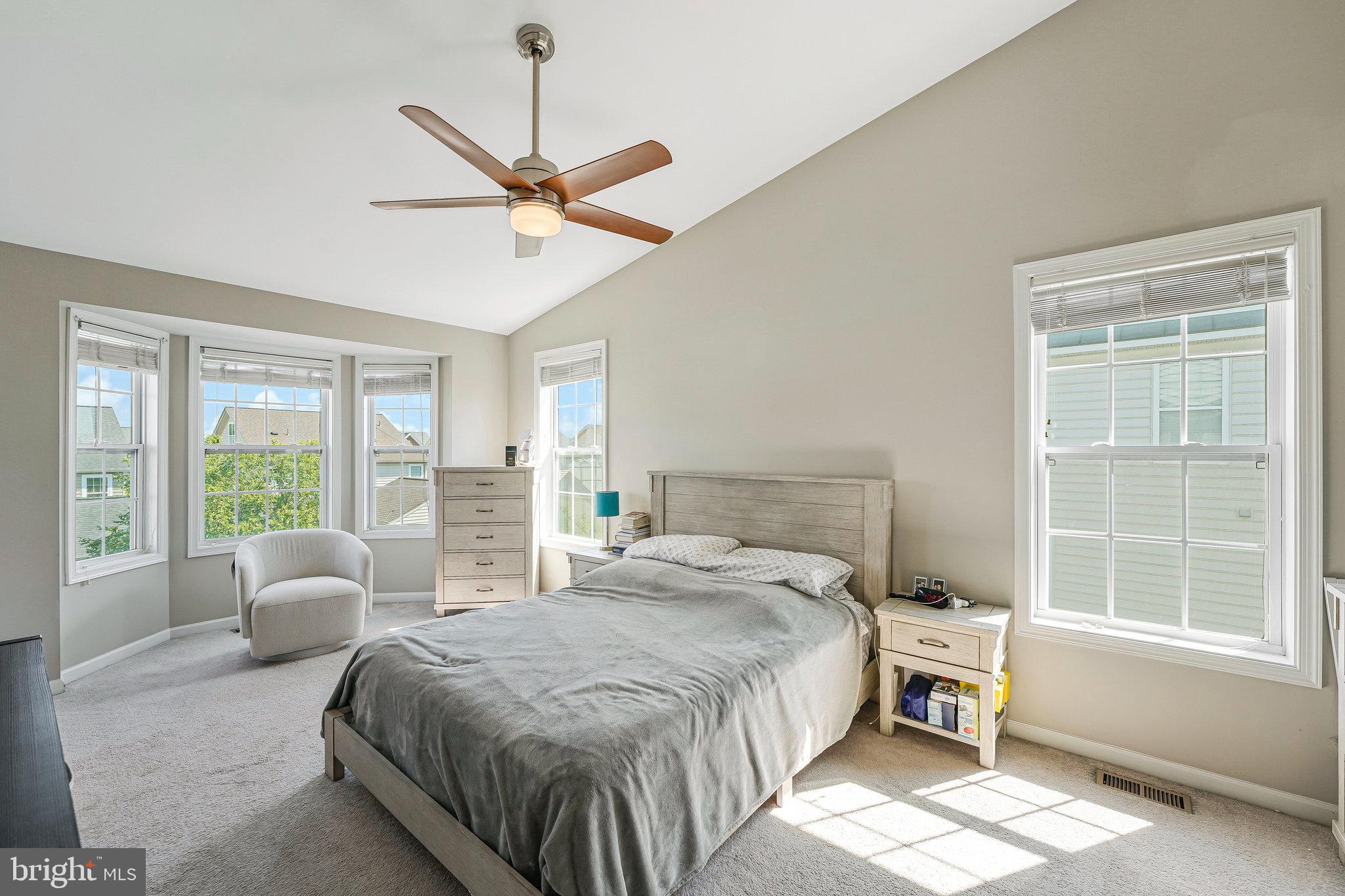 23073 Weybridge Square Broadlands, VA 20148 - Photo 11 of 24 a spacious bedroom with a bed and a large window