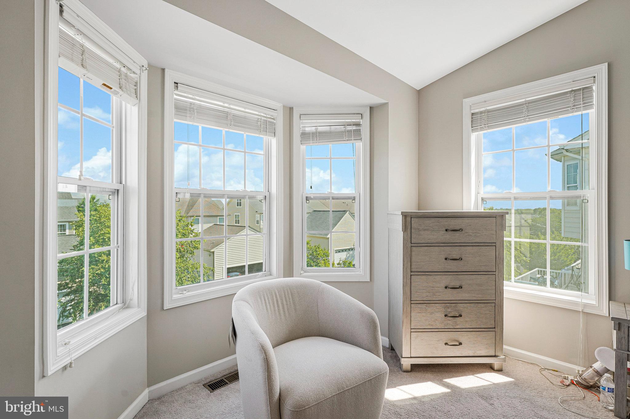 23073 Weybridge Square Broadlands, VA 20148 - Photo 13 of 24 a living room with furniture and windows