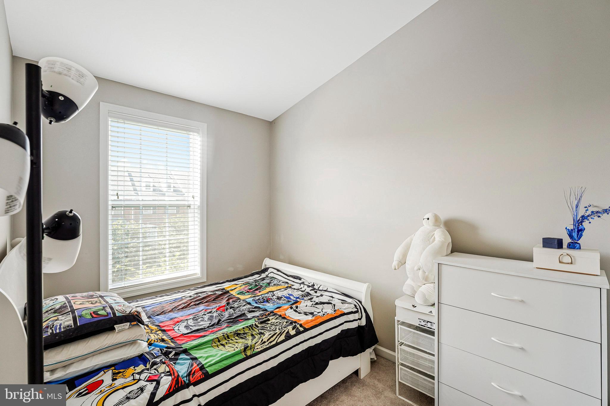 23073 Weybridge Square Broadlands, VA 20148 - Photo 17 of 24 a bedroom with bed and a window