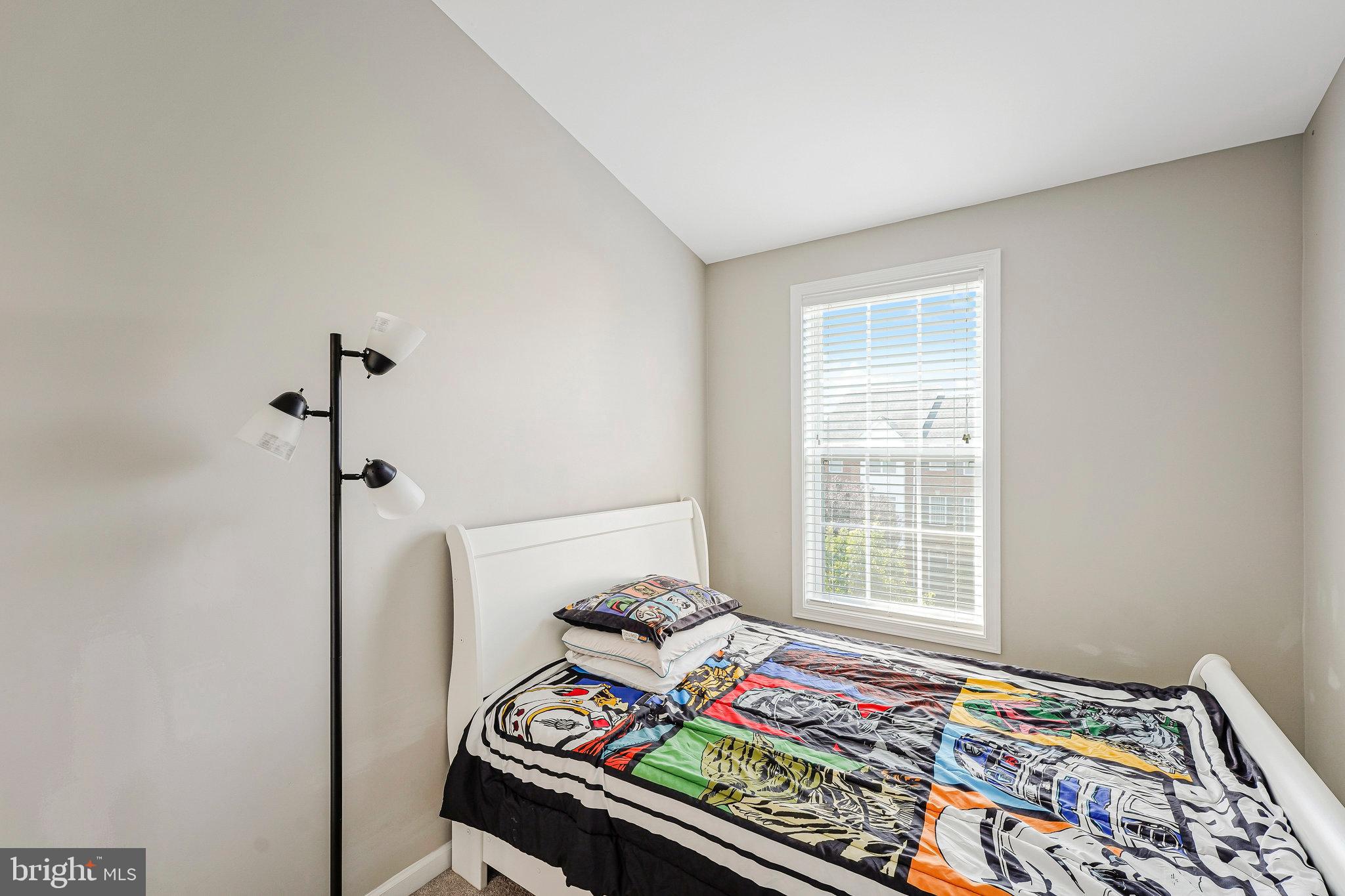 23073 Weybridge Square Broadlands, VA 20148 - Photo 18 of 24 a bedroom with bed and a window
