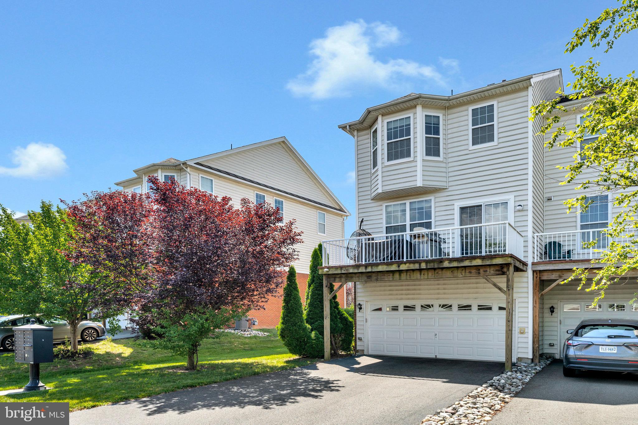 23073 Weybridge Square Broadlands, VA 20148 - Photo 24 of 24 a front view of a house with a yard