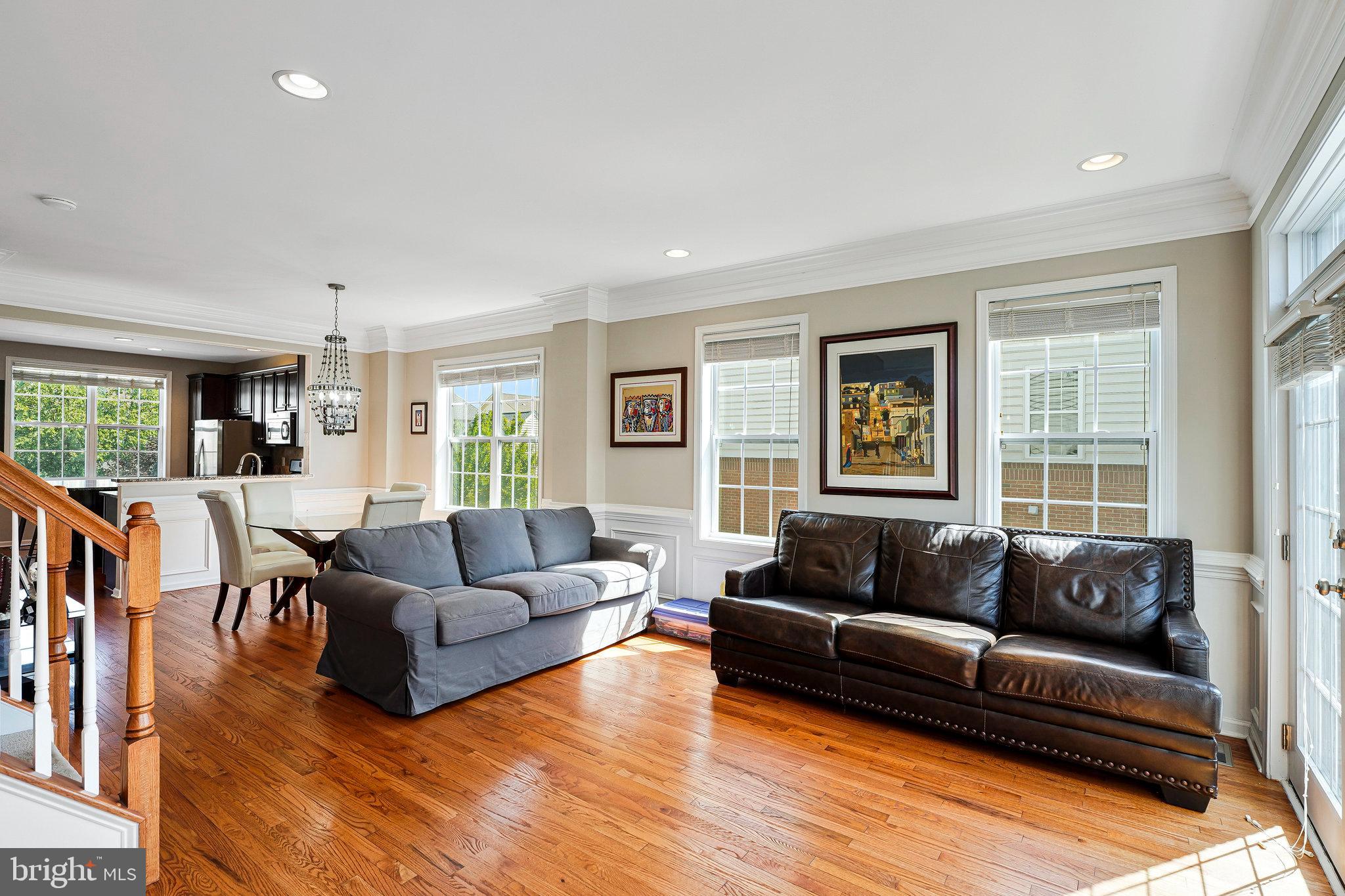 23073 Weybridge Square Broadlands, VA 20148 - Photo 4 of 24 a living room with furniture and a large window