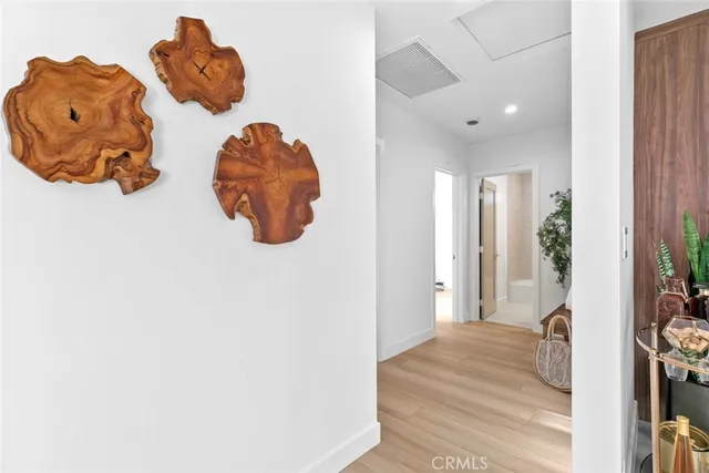 a spacious bedroom with two beds and a large window