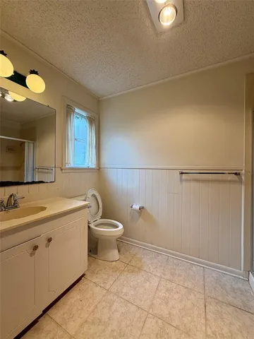 a bathroom with a mirror and a shower