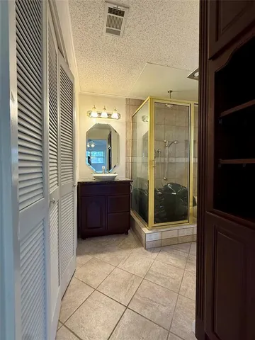 a view of an empty room with a staircase