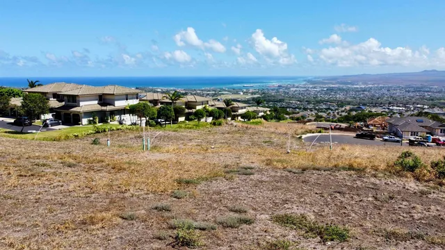 a view of a town with mountains in the background