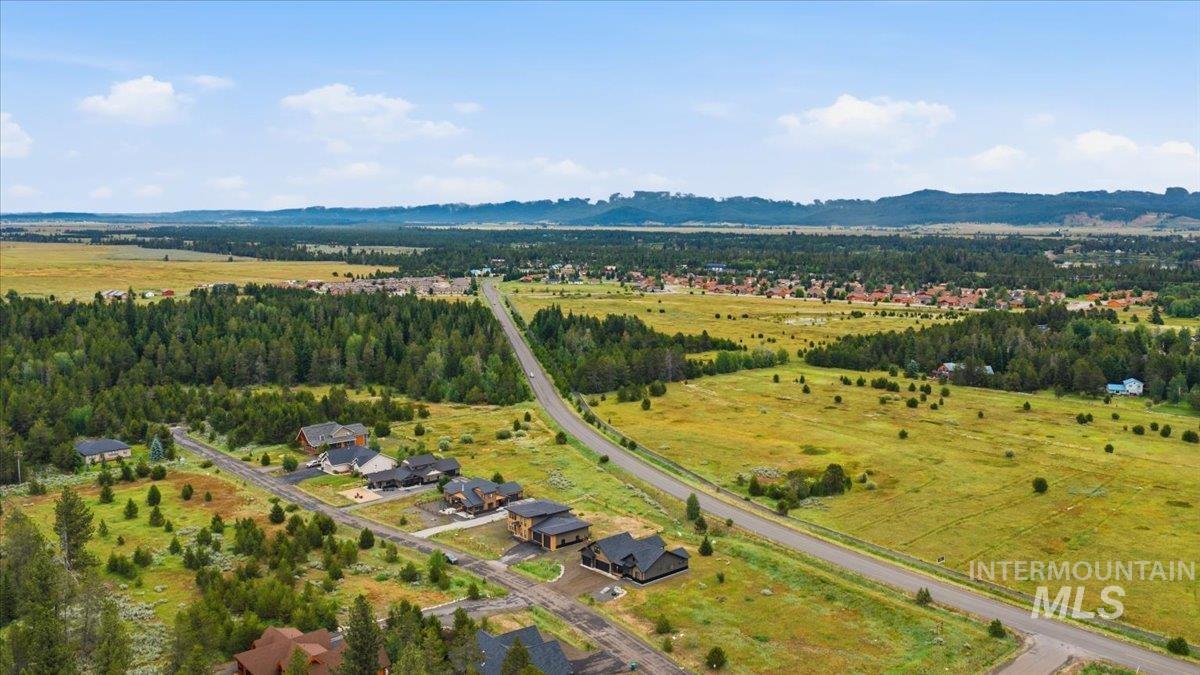 13152 Hawks Bay Road Donnelly, ID 83615 - Photo 28 of 29 Expansive aerial view showcasing multiple residential properties amidst a natural landscape