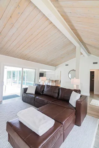 a large living room with furniture and a large window