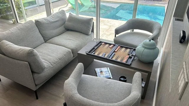 a living room with furniture and a window