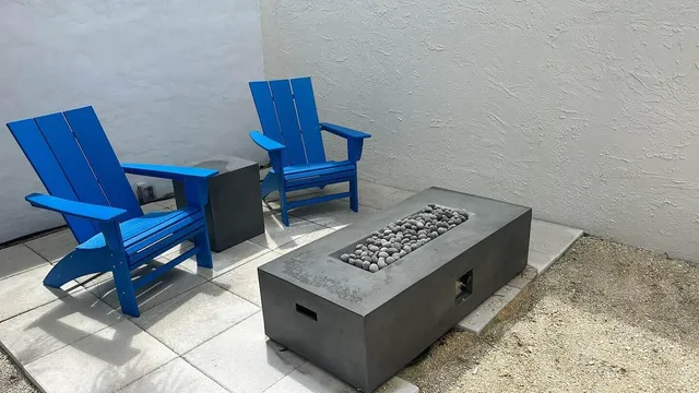 a view of a patio with table and chairs potted plants with wooden floor