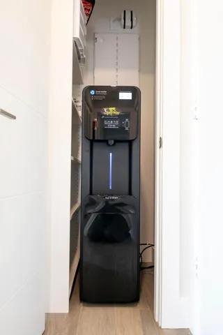 a view of a white house with swimming pool and sitting area