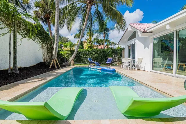 a view of a backyard with a patio