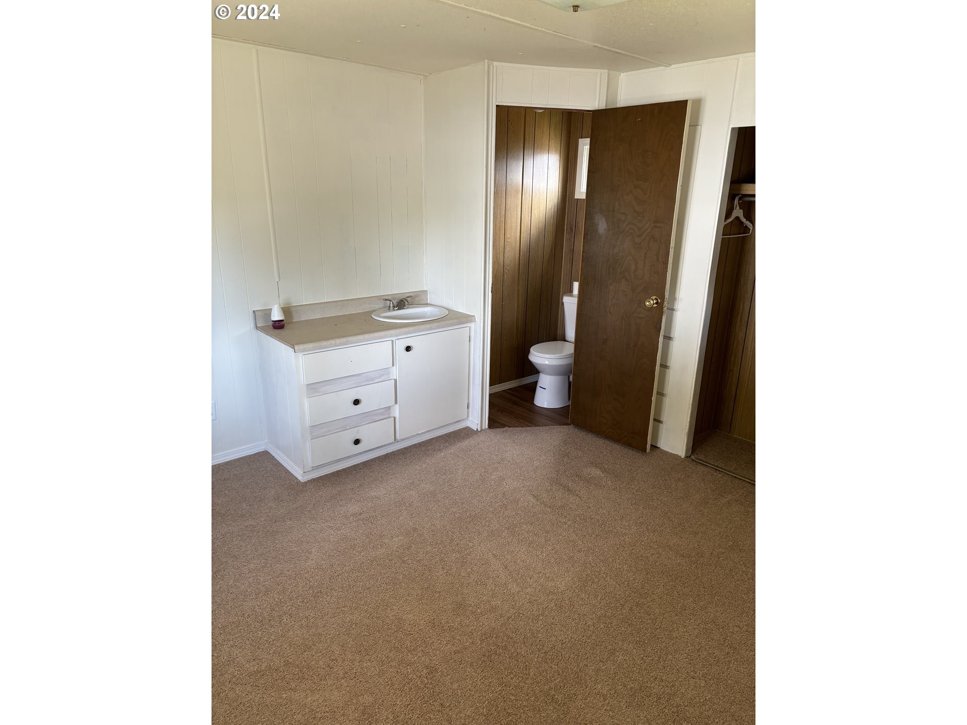 205 South 54th Street Springfield, OR 97478 - Photo 11 of 19 a view of a room that has a bed and a mirror in it