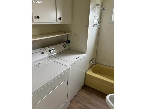 a utility room with dryer and washer