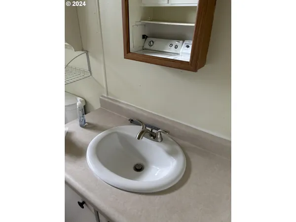 a bathroom with a sink and a mirror