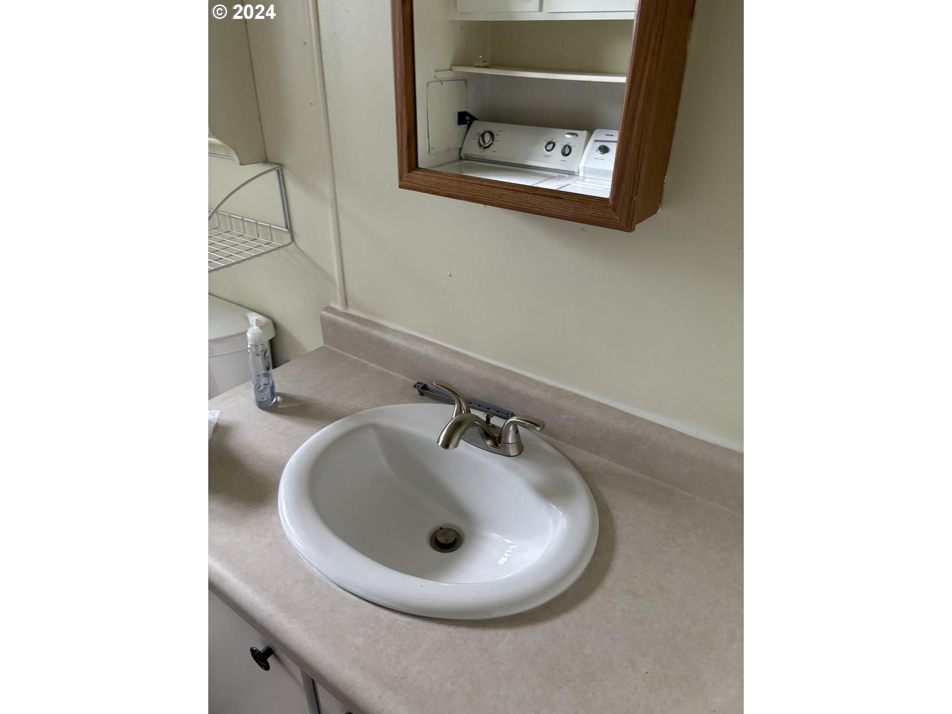 205 South 54th Street Springfield, OR 97478 - Photo 14 of 19 a bathroom with a sink and a mirror