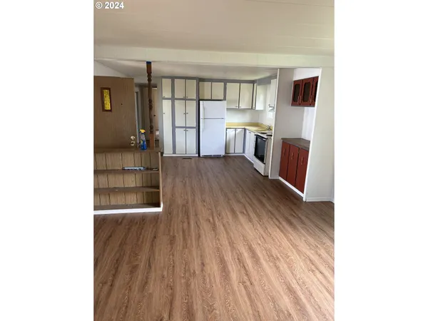 a view of a living room with a wooden floor