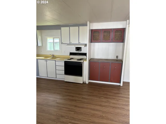 a view of kitchen with wooden floor