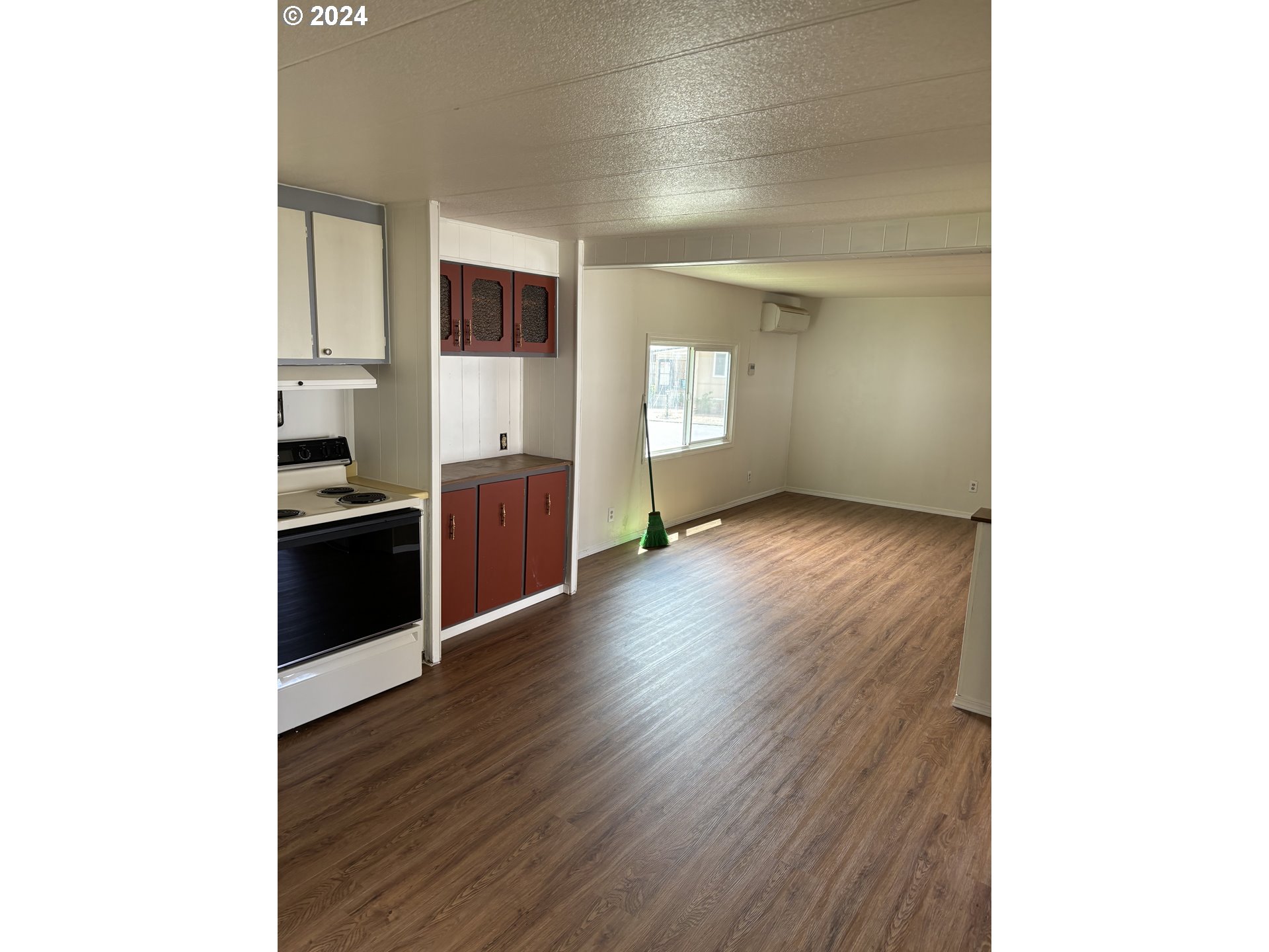 205 South 54th Street Springfield, OR 97478 - Photo 8 of 19 a view of a kitchen with wooden floor and electronic appliances