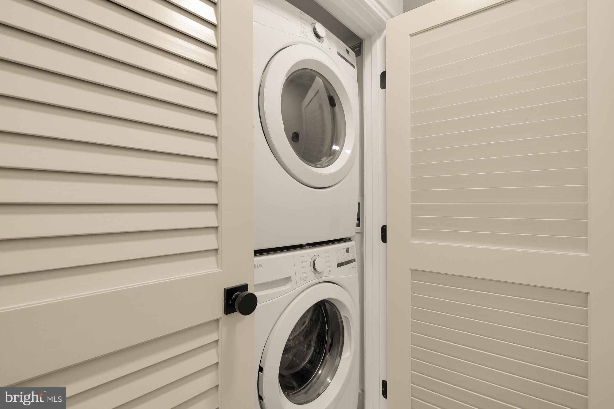 1463 Harvard Street Northwest, Unit 2 Washington, DC 20009 - Photo 12 of 25 a utility room with dryer and washer