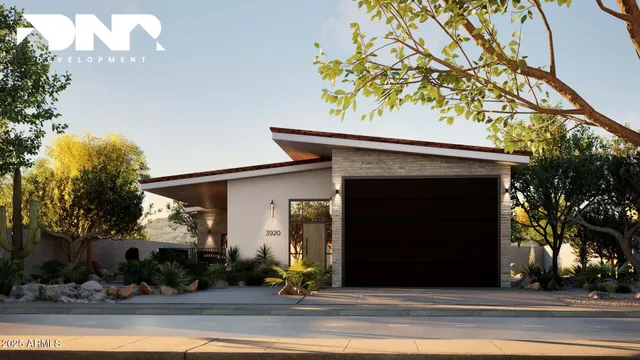 a view of a house with a yard and garage
