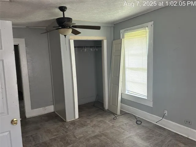 a view of a hallway to a closet