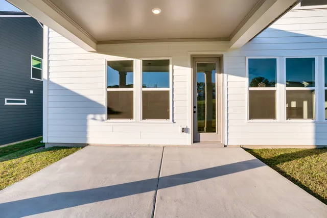 a view of yard with porch and patio