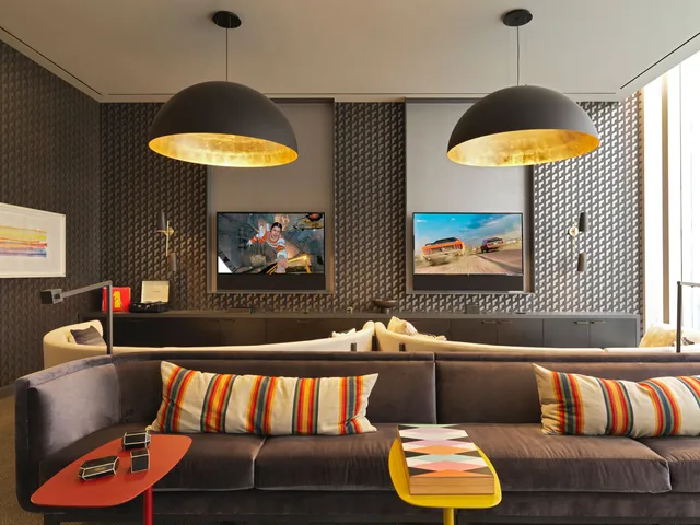 a living room with furniture and a lamp