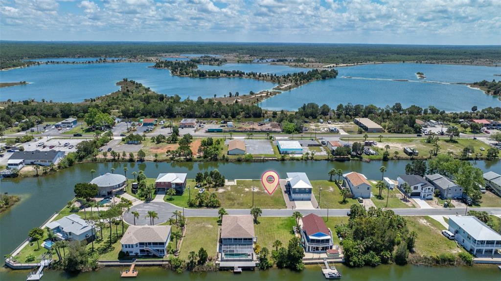 3398 Fernleaf Drive Hernando Beach, FL 34607 - Photo 2 of 11 an aerial view of ocean and residential houses with outdoor space and lake view