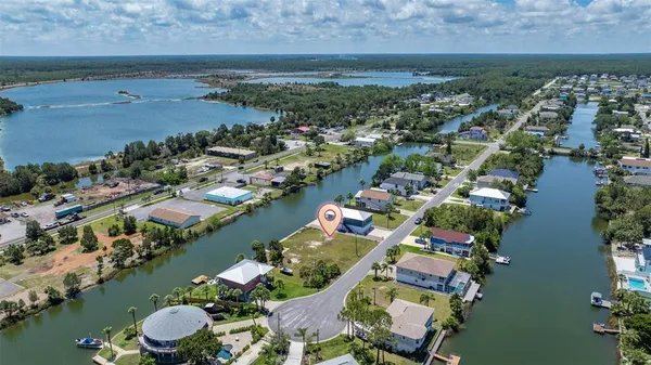 an aerial view of a houses and an outdoor space