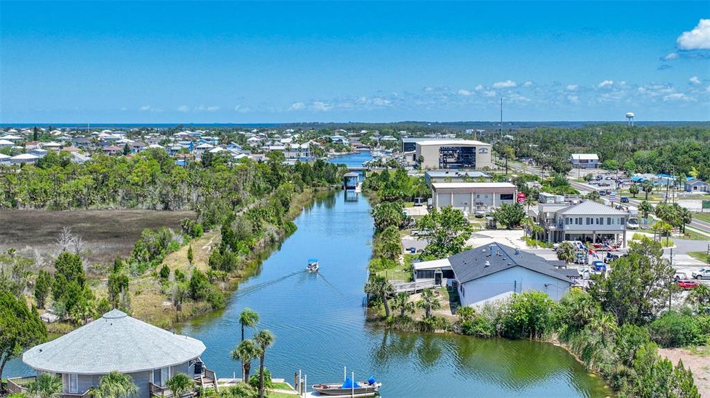 3398 Fernleaf Drive Hernando Beach, FL 34607 - Photo 10 of 11 an aerial view of residential houses with outdoor space and lake view