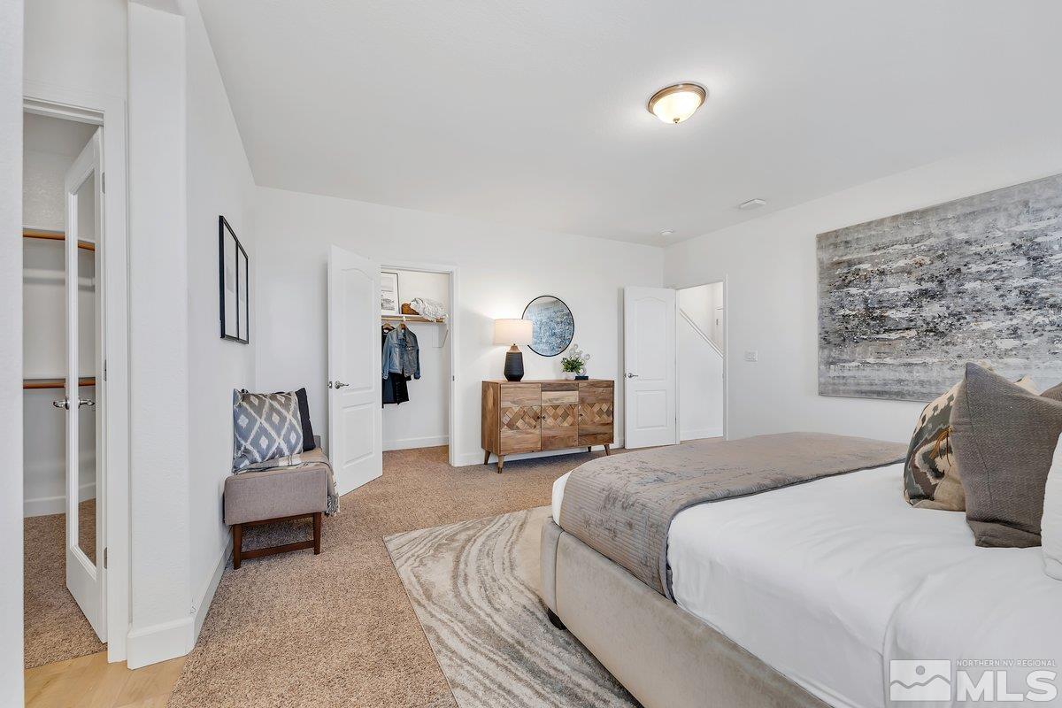10537 Claim Jumper Way Reno, NV 89521 - Photo 27 of 40 a bedroom with a bed and couch