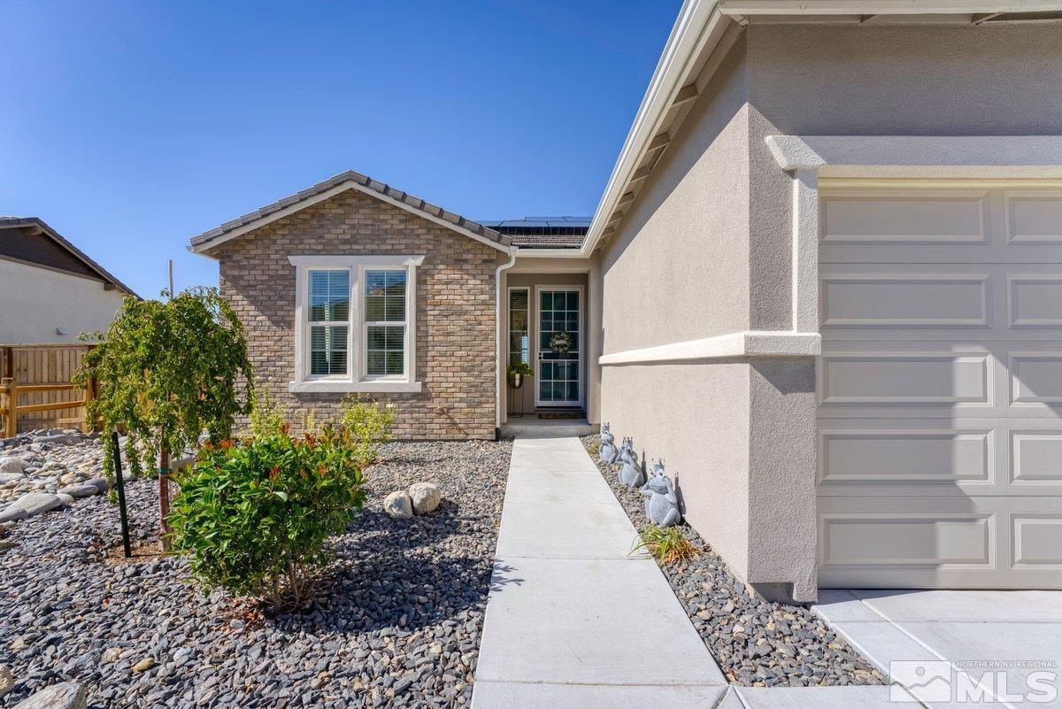 10537 Claim Jumper Way Reno, NV 89521 - Photo 6 of 40 a front view of a house with a yard