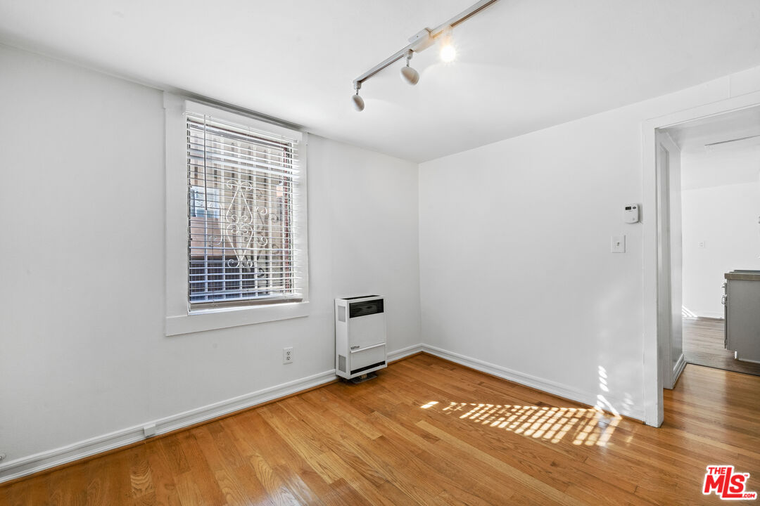 28 Clubhouse Avenue, Unit 1/2 Venice, CA 90291 - Photo 12 of 21 a view of empty room with wooden floor and fan