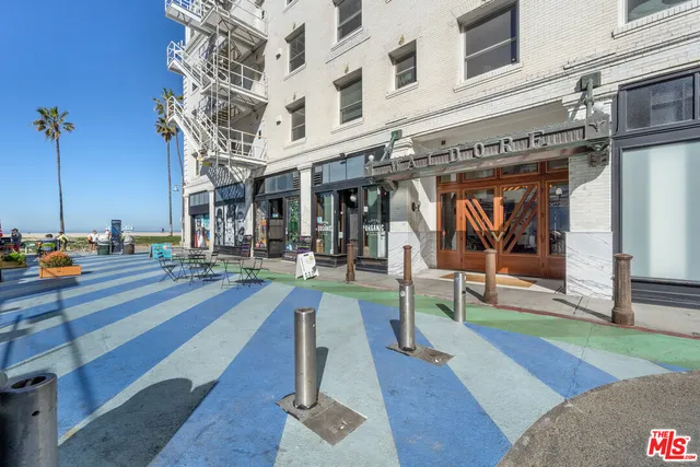 a view of a building with sitting area