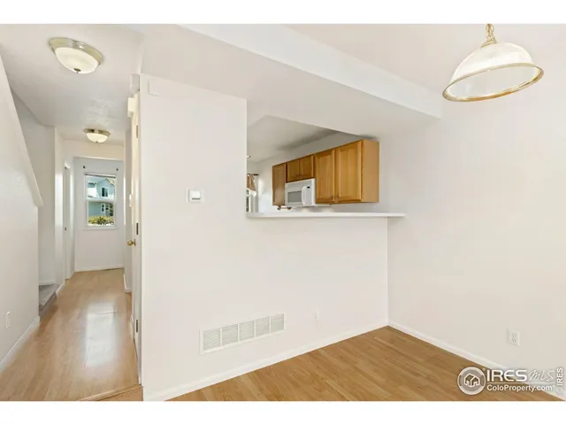 a view of a living room with a wooden floor