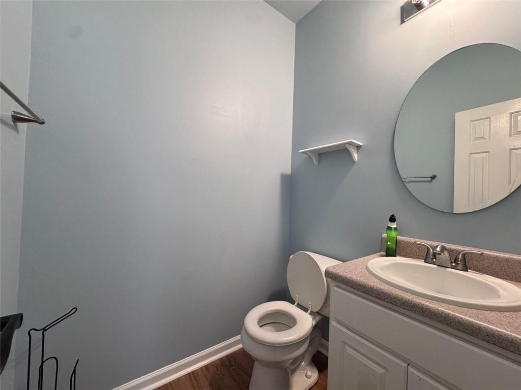 5495 Hampton Court Atlanta, GA 30349 - Photo 12 of 20 a bathroom with a sink and a mirror