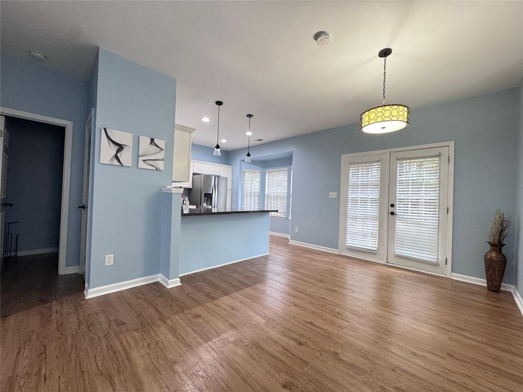 5495 Hampton Court Atlanta, GA 30349 - Photo 13 of 20 a view of empty room with wooden floor and window