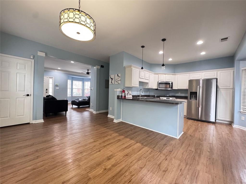 5495 Hampton Court Atlanta, GA 30349 - Photo 14 of 20 a view of kitchen with cabinets and stainless steel appliances