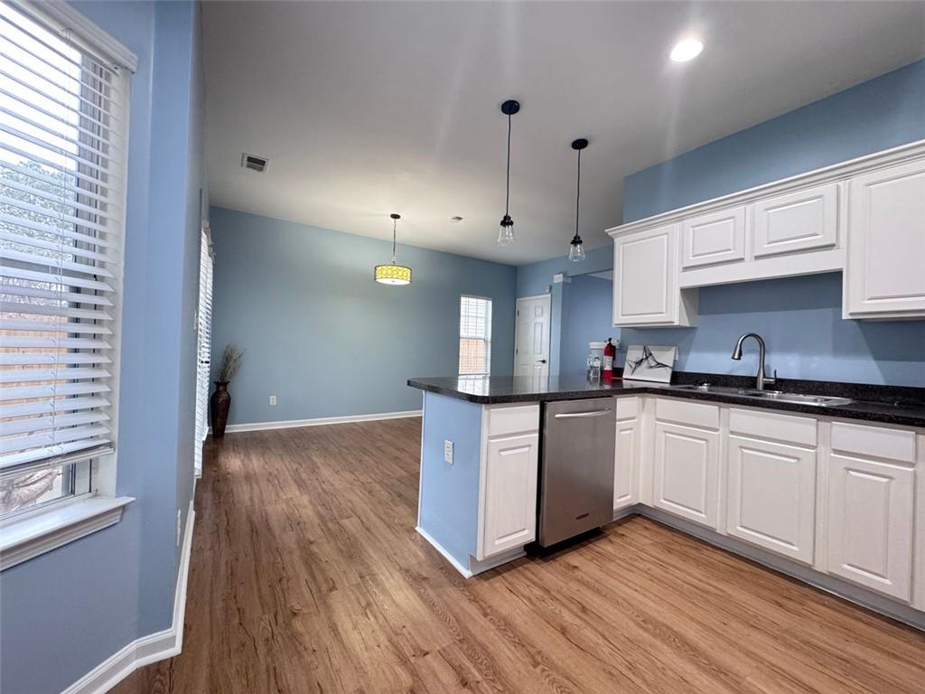 5495 Hampton Court Atlanta, GA 30349 - Photo 15 of 20 a kitchen with granite countertop a stove a sink and a refrigerator