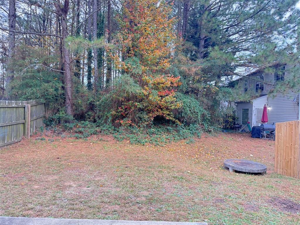 5495 Hampton Court Atlanta, GA 30349 - Photo 19 of 20 a view of a street with some trees