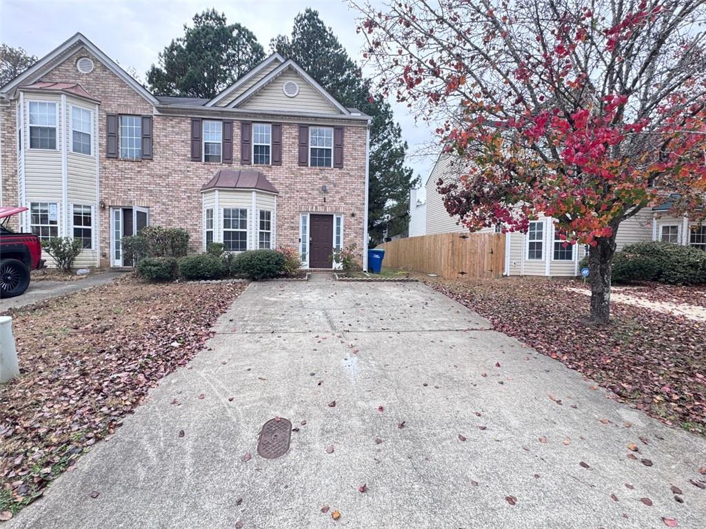 5495 Hampton Court Atlanta, GA 30349 - Photo 20 of 20 a front view of a house with a yard