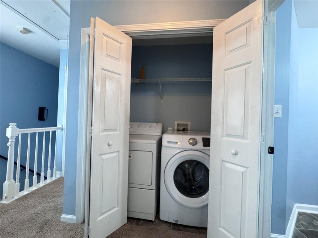5495 Hampton Court Atlanta, GA 30349 - Photo 5 of 20 a utility room with dryer and washer