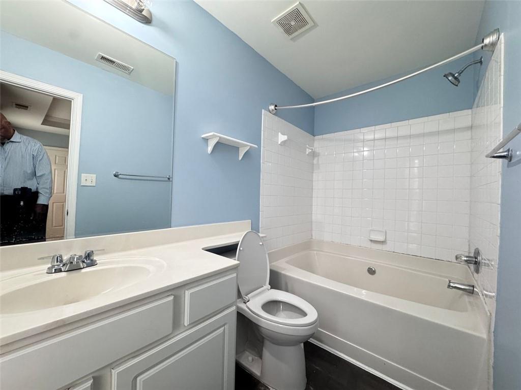 5495 Hampton Court Atlanta, GA 30349 - Photo 10 of 20 a bathroom with a sink a toilet and a bathtub