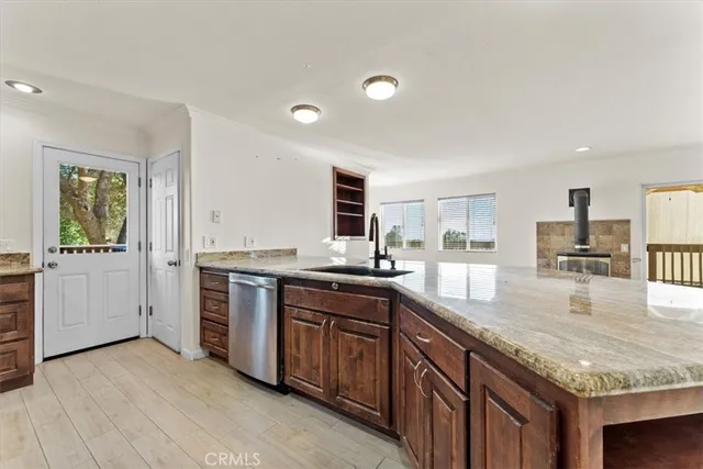a view of storage and utility room with wooden floor