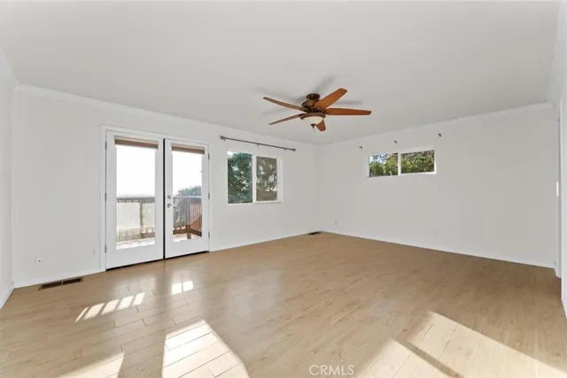 a view of a hallway with a table and chairs