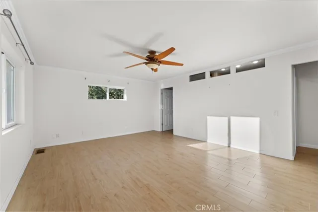 a living room with furniture window and wooden floor
